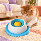 Blue and white rotating pet lick toy with yellow center ball in a supervised pet play scene