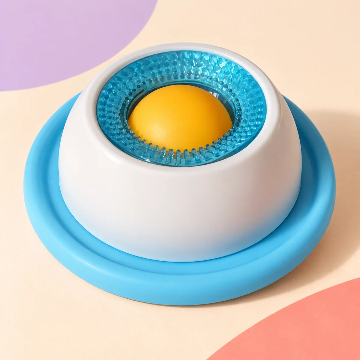 Blue and white rotating pet lick toy with yellow center ball, shown from another angle