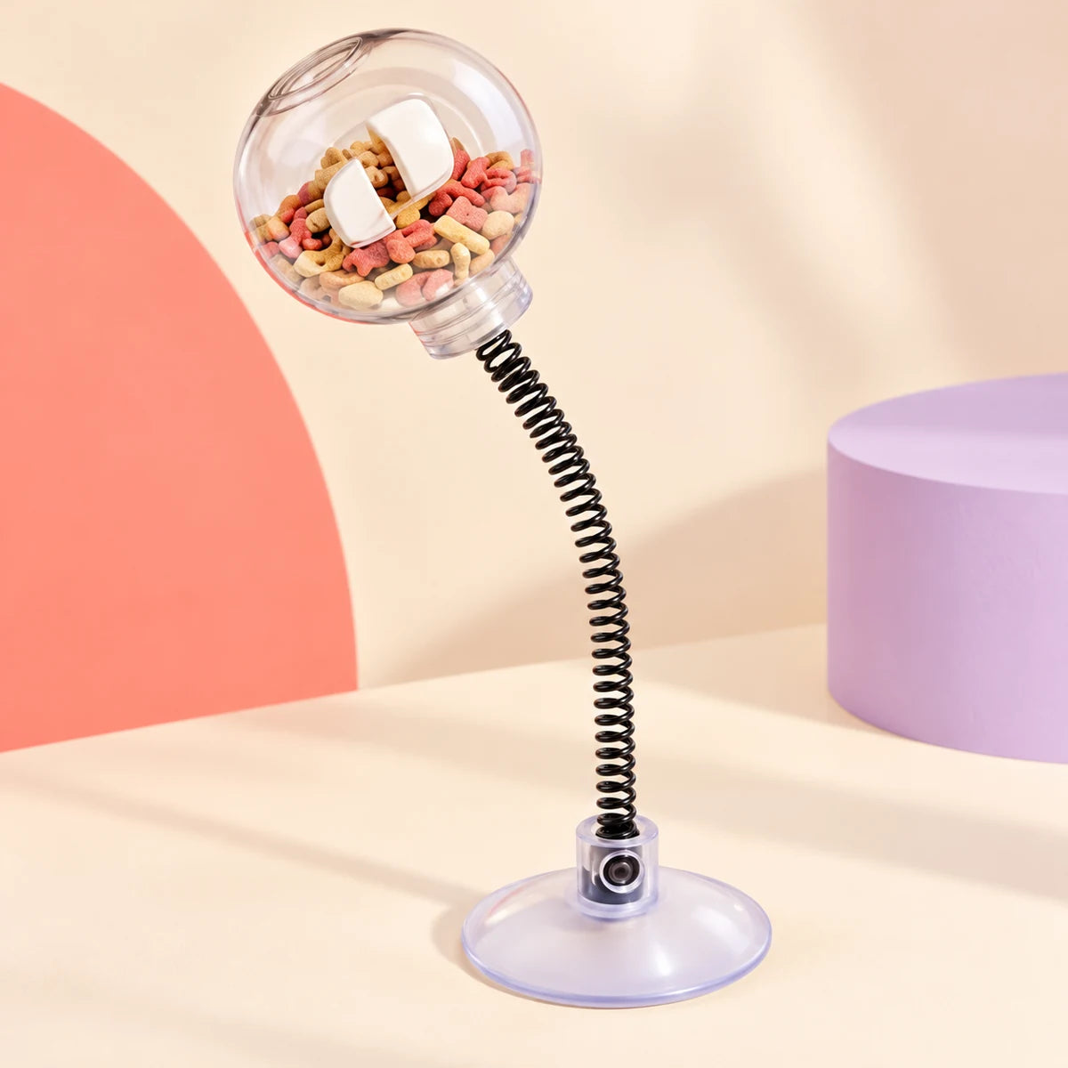 31 cm spring-mounted clear cat treat ball on a circular base shown from another angle
