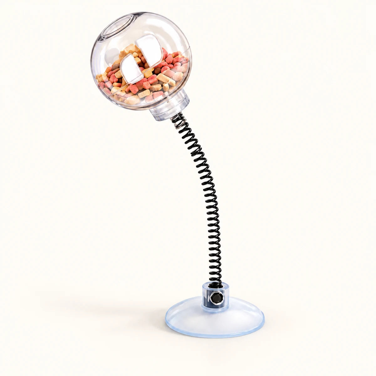 31 cm spring-mounted clear cat treat ball on a circular base on a clean off-white background